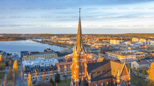 Aerial timelapse of Luleå cathedral and cityscape at sunset