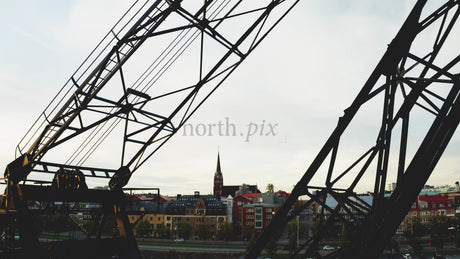 Autumn Evening in Luleå: City Landscape Silhouette With Crane and Church