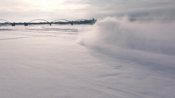 Tractor clearing snow on frozen river in Luleå - winter landscape